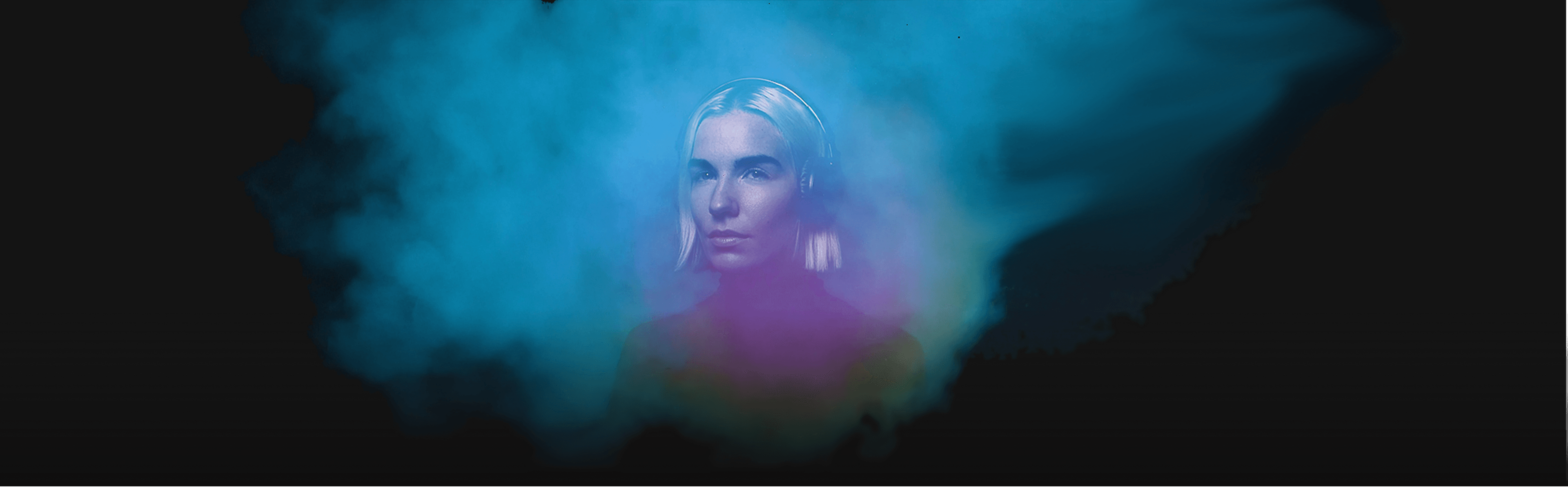 Woman with headphones in atmospheric blue light